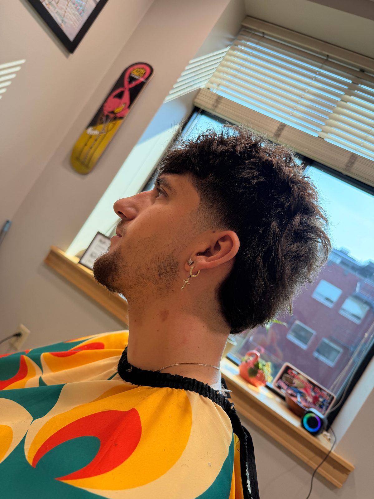 Textured mullet with a taper fade and clean neckline, cut at The Barber Studio in downtown Missoula